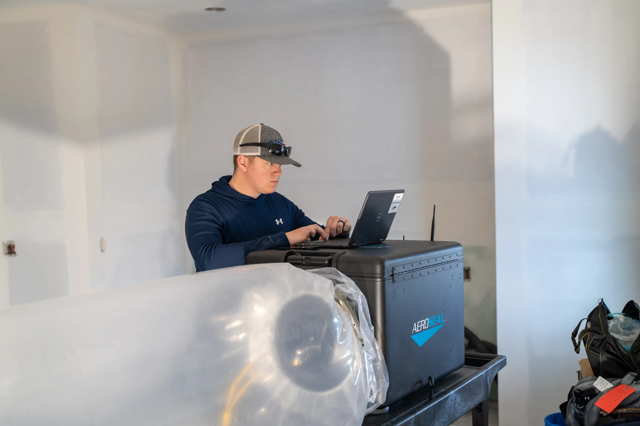 Aeroseal installation team preparing equipment for duct sealing service