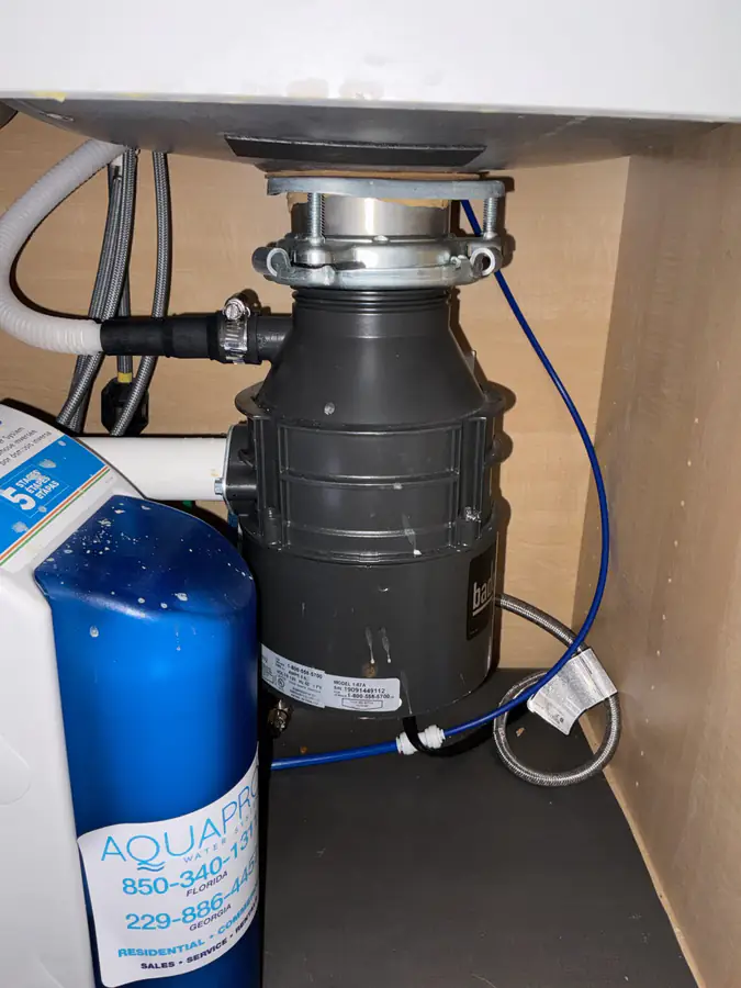 Old garbage disposal in Freeport FL before replacement