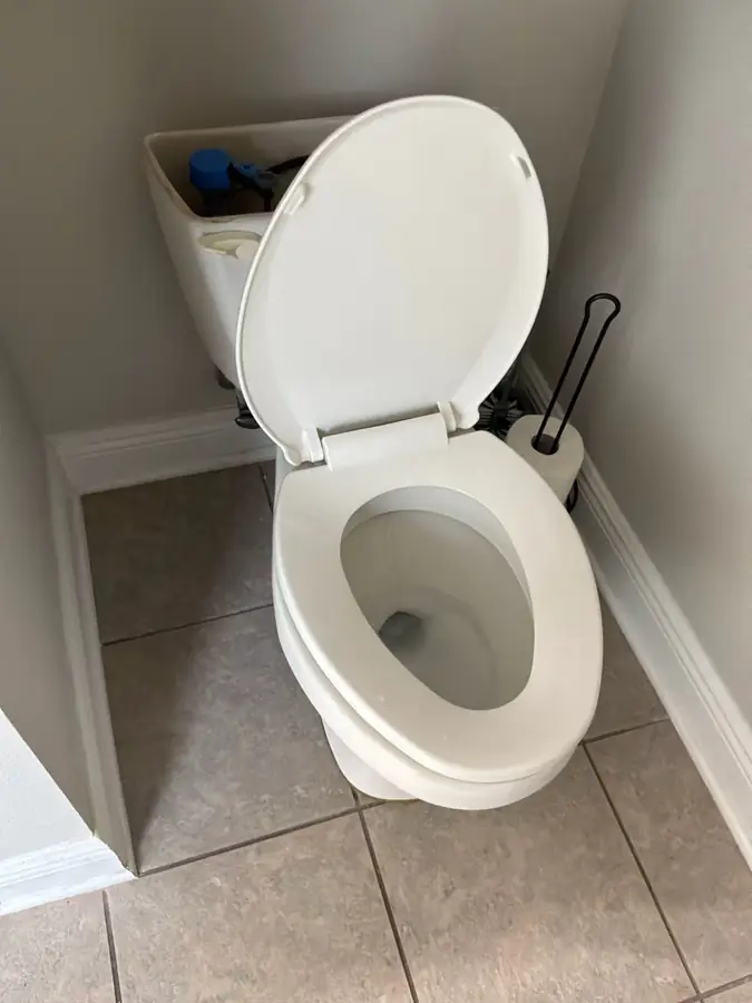 Old toilet in Freeport FL before replacement